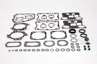 Cometic C9976 EST top end gasket kit for engine repair, shown with assorted gaskets and seals