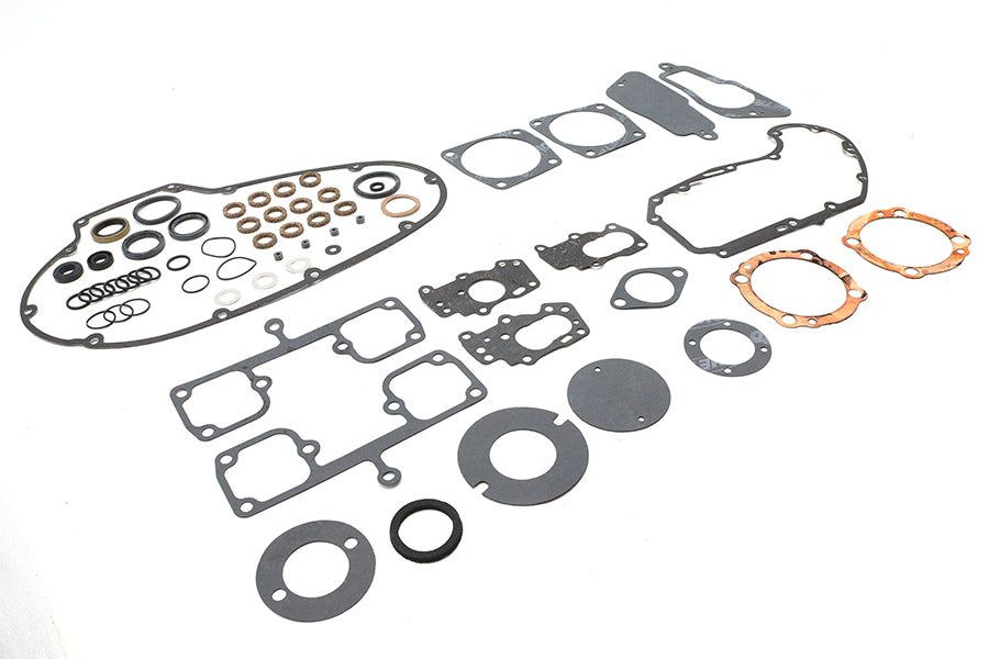 Cometic C9047F complete engine gasket kit with assorted gaskets and seals laid out for inspection