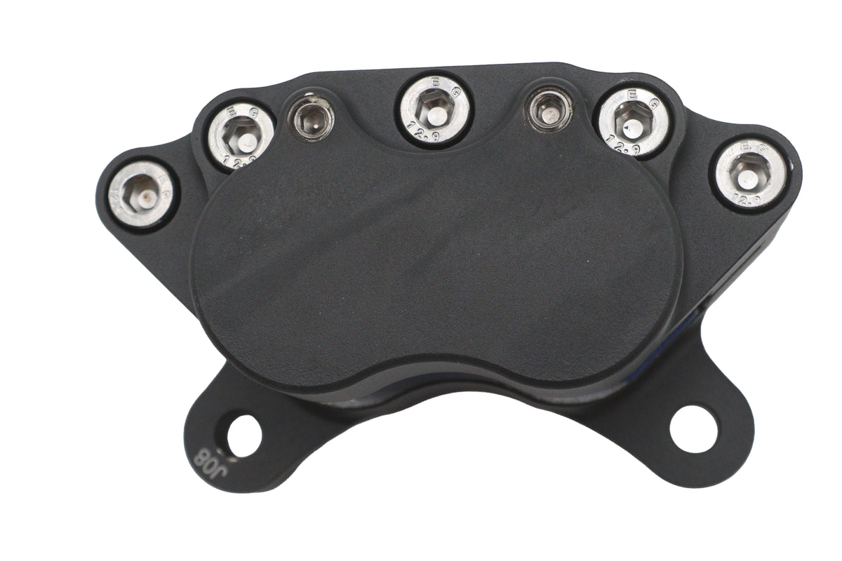 Ultima 23-9860 4-piston black brake caliper viewed from the side