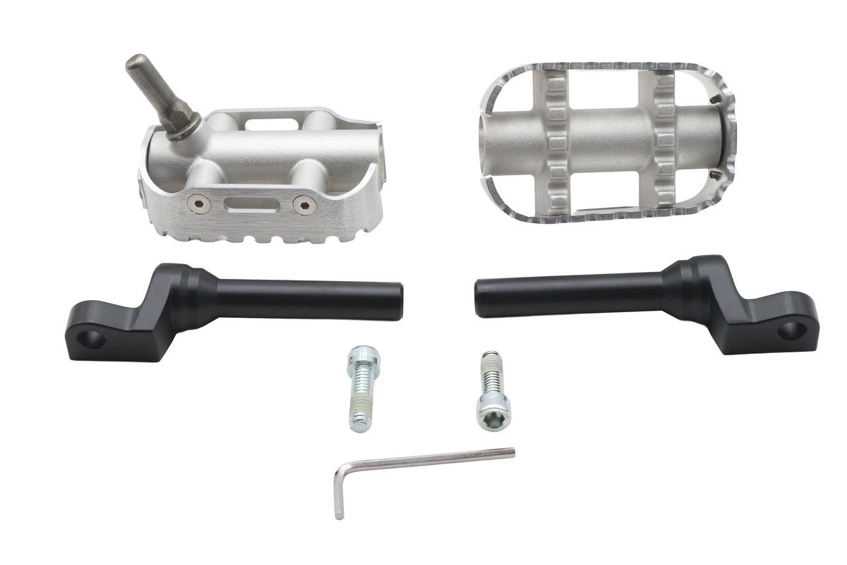 OE True Grit footpeg set 50501394, durable black motorcycle footpegs with textured grip surface
